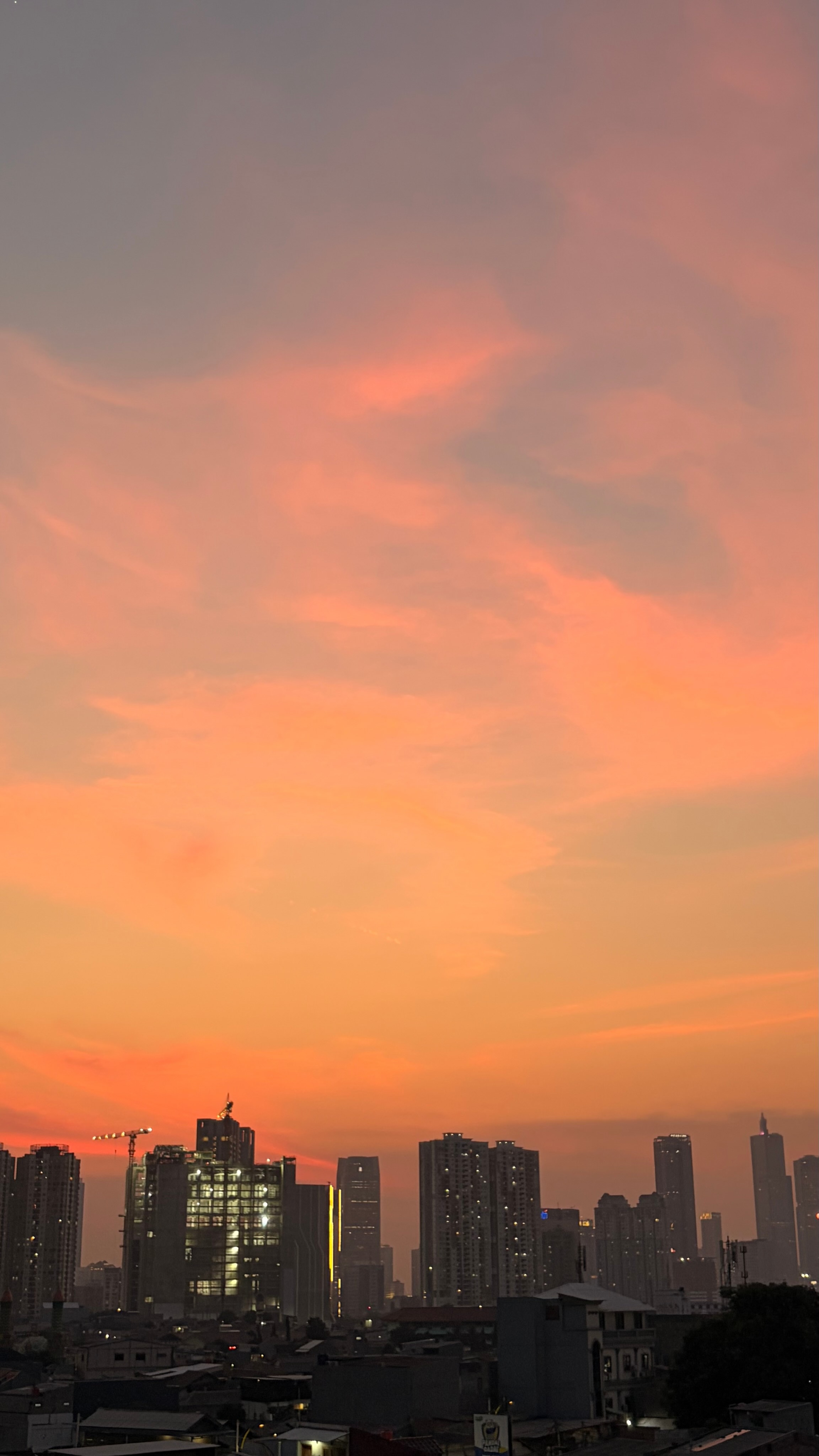 An orange sunset above the city skyline